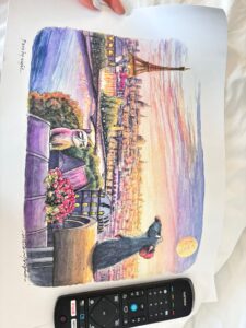 Picture from a street vendor in Paris, Remi the rat sat on a rooftop looking out over the skyline of Paris. 